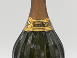 a bottle of champagne sitting on a white surface