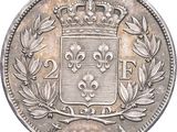 a close up of a coin with a crown on top of it