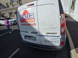 a white van that is parked in a parking lot