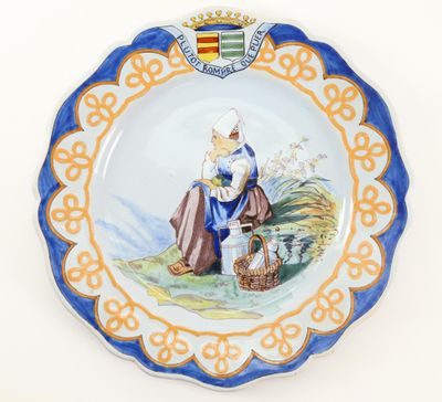 an image of a plate with a picture of a woman sitting on a bench
