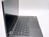 a black laptop with a silver keyboard on a white surface