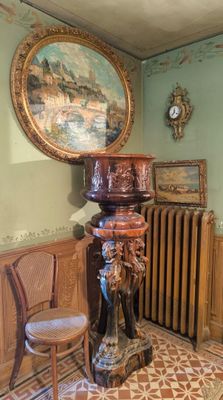 a painting on the wall above a radiator in a room
