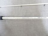 an image of a close up of two fishing rods on a cloth