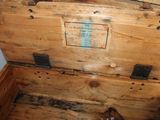 a wooden chest with a label on it