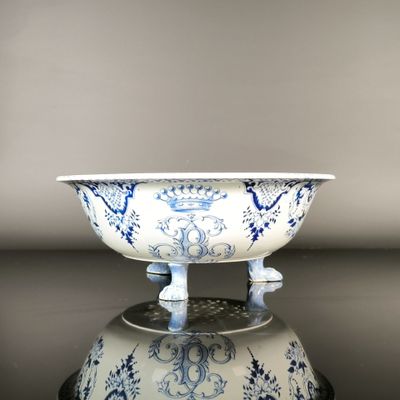 a blue and white bowl sitting on top of a table
