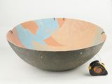 a bowl that has a tape on the side of it