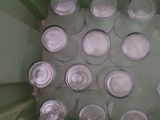 a lot of empty glasses in a green container