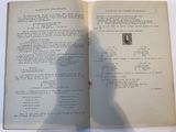 an open book with a shadow of a person standing in front of it