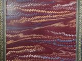 a painting of a red and blue pattern on a white wall