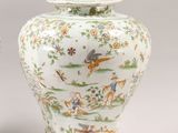 pair of chinese vases with animals and flowers on them