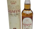 a bottle of gleneyne single malt whisky next to a cardboard box