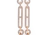 a pair of earrings with pearls and diamonds on a white background