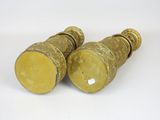 pair of antique brass candlesticks on a white background