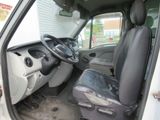 a white van with a black seat and steering wheel