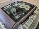 an image of a car that is parked in a garage