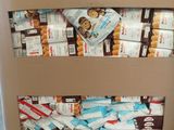 a cardboard box full of snacks on a pallet