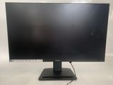a computer monitor sitting on top of a white table