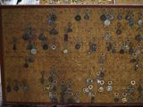 a cork board with a bunch of buttons on it