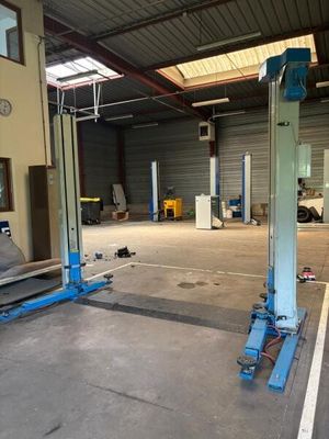 an image of a garage with a car in the middle of it