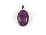 a purple stone pendant on a gold plated chain