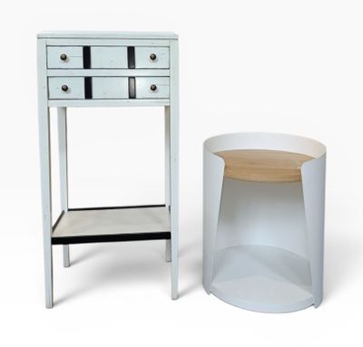 a white table with a drawer next to it and a small table with a drawer