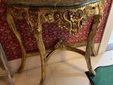 a small table with a mirror on top of it