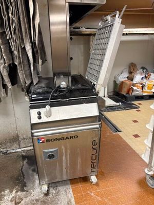 an image of a commercial kitchen with a stove and oven