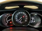 a close up of a car dashboard with a speedometer and gauges
