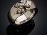 an image of a silver ring with a cross on it