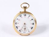 a gold pocket watch with roman numerals on it