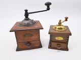 pair of antique wooden coffee grinders with brass knobs