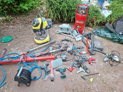 a lot of tools that are laying out on the ground