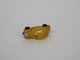 a yellow toy car that is sitting on a white surface