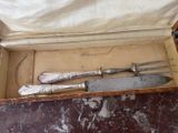 three knives in a box on a table