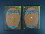 two decks of magic the gathering deck are shown on a table