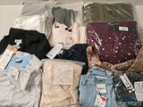many different types of clothes on display in a box