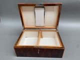a wooden box that has two compartments inside of it