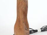 wooden table lamp with a cord plugged into the base
