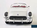 a white model of a car with a red top