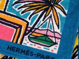 a towel that has a picture of a plant on it