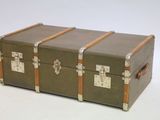 three trunks sitting on top of each other on a white surface