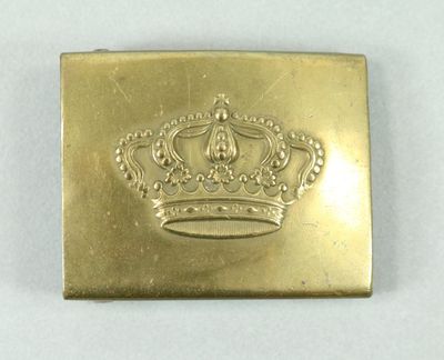 an image of a gold plate with a crown on it