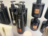 many different types of shampoos and lotions on the counter