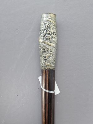a close up of a cane with a design on it