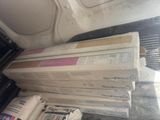 a lot of boxes that are sitting in the back of a truck