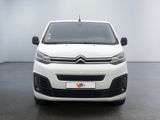 the front of a white citrole parked in a white room