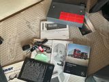 a lot of items sitting on the floor of a car
