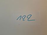 une pancarte sur la porte des toilettes indiquant « 1932 »