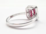 an image of a diamond and ruby ring on a white background