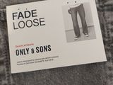 the label on the back of a pair of jeans reads fade loose